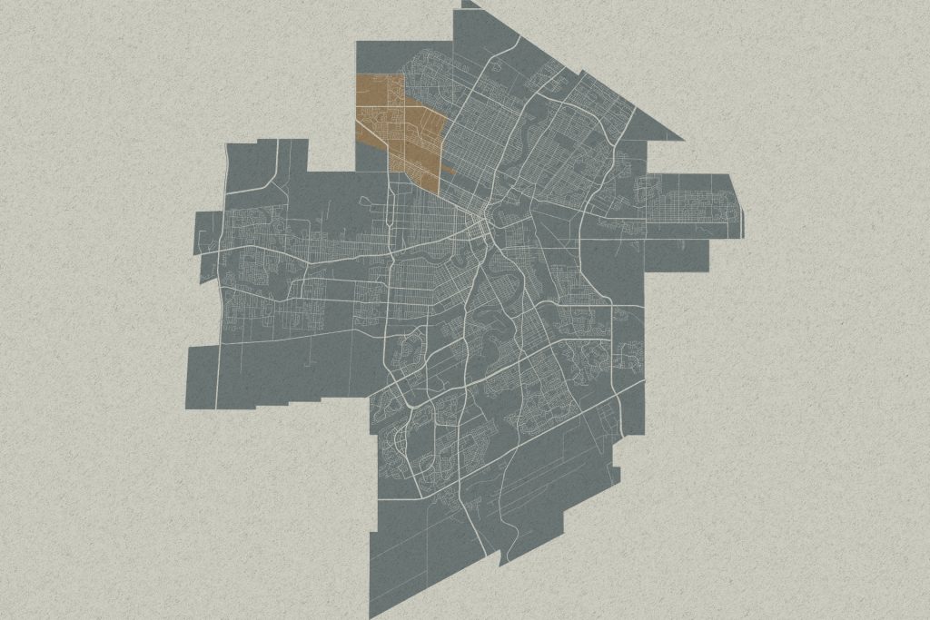 Stylized city map with one highlighted neighborhood in tan