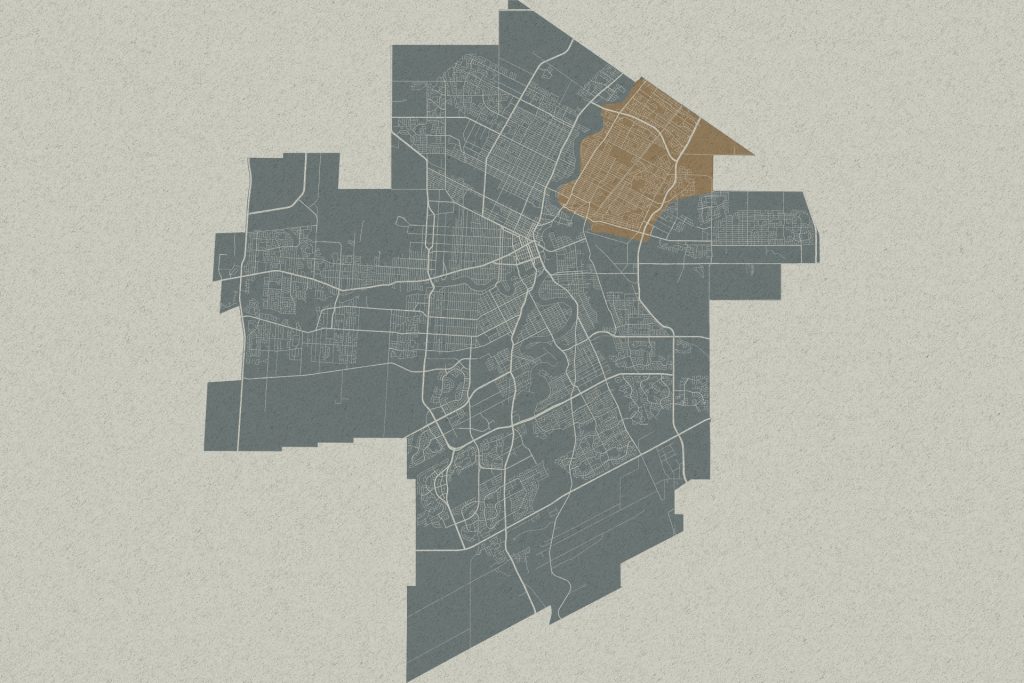 Stylized city map with one northeastern district highlighted in tan