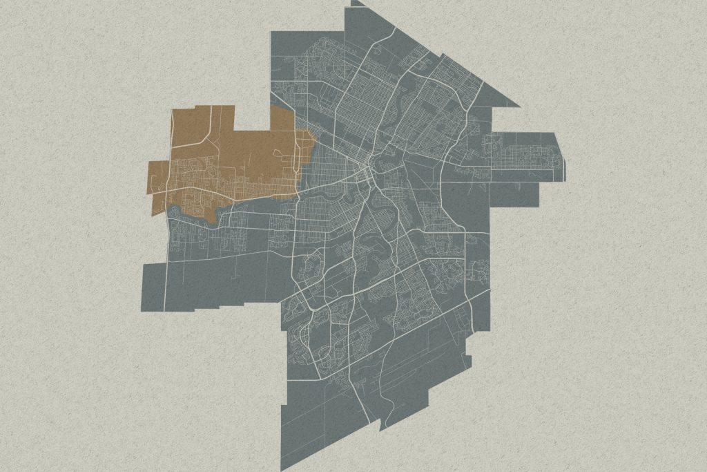 Stylized city map with highlighted brown and gray districts and major roads
