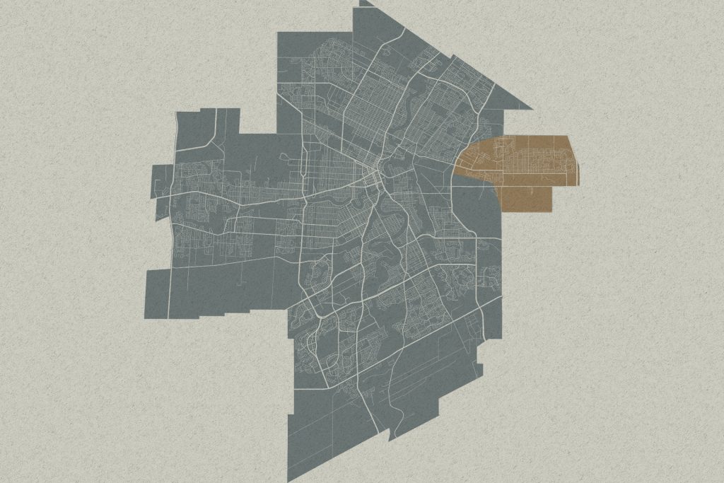 Stylized city map with a highlighted brown area on the east side